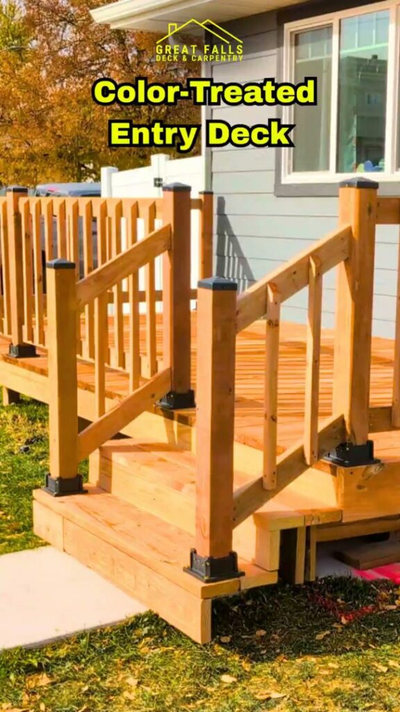 A beautifully color-treated wooden entry deck with matching railings and stairs, built by Great Falls Deck & Carpentry in Great Falls, MT.