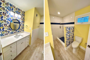 A vibrant bathroom remodel with floral wallpaper, yellow walls, a vanity, and a walk-in shower by Prestige Services in Annapolis, MD.