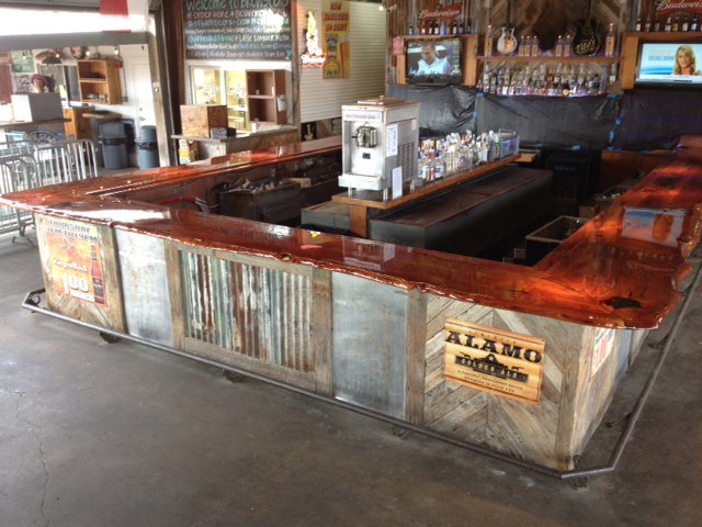 Completed commercial bar build-out with rustic wood and metal finishes by Gourley Contractors, LLC, Corpus Christi, TX.