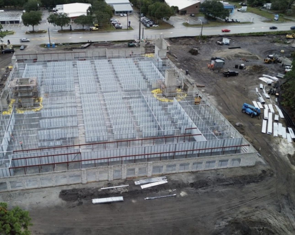 Aerial view of a large commercial building under construction by MEC General Contractors in Melbourne, FL.