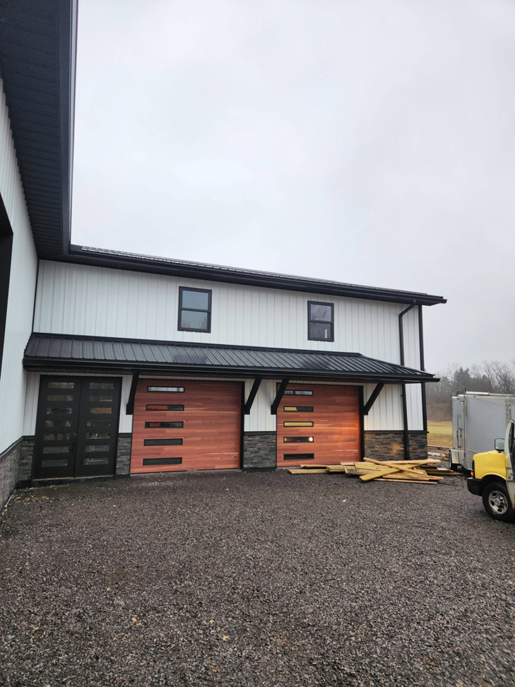 The entrance and garage doors of a commercial building, a construction project by J and R Contracting in Buffalo, NY.