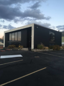 Exterior of a modern commercial building, showcasing construction work by Do It All Contracting in Rochester, NY.