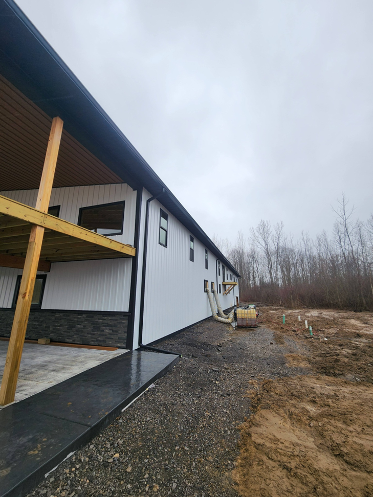 The exterior of a commercial building with a newly built covered deck, completed by J and R Contracting in Buffalo, NY.