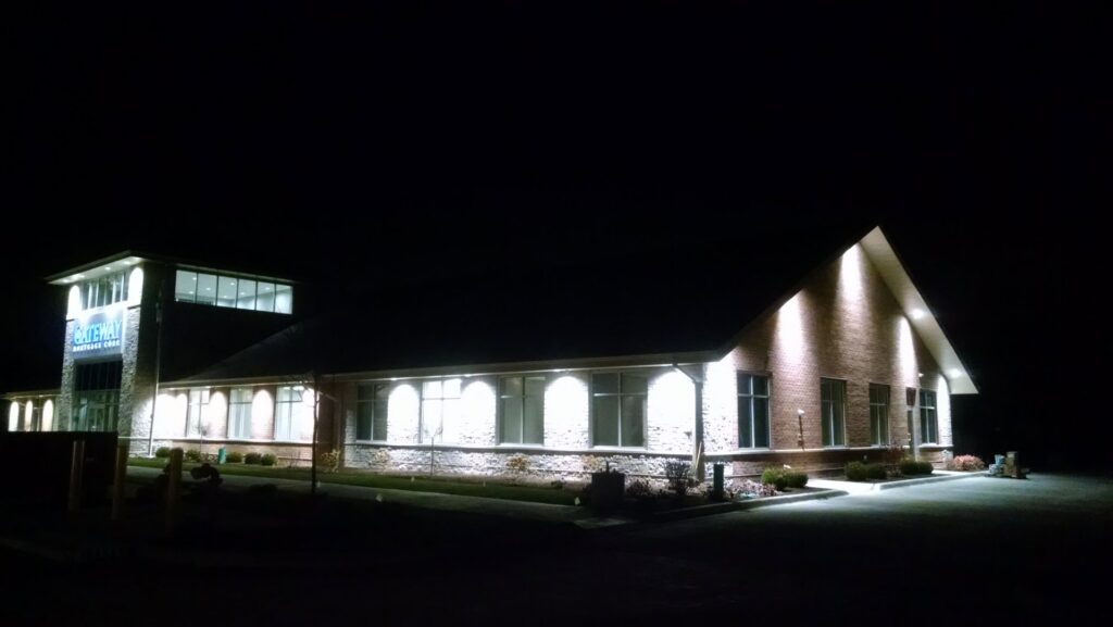 Exterior lighting illuminating a commercial building at night, installed by Valiant Electric Inc. in Kenosha, WI.