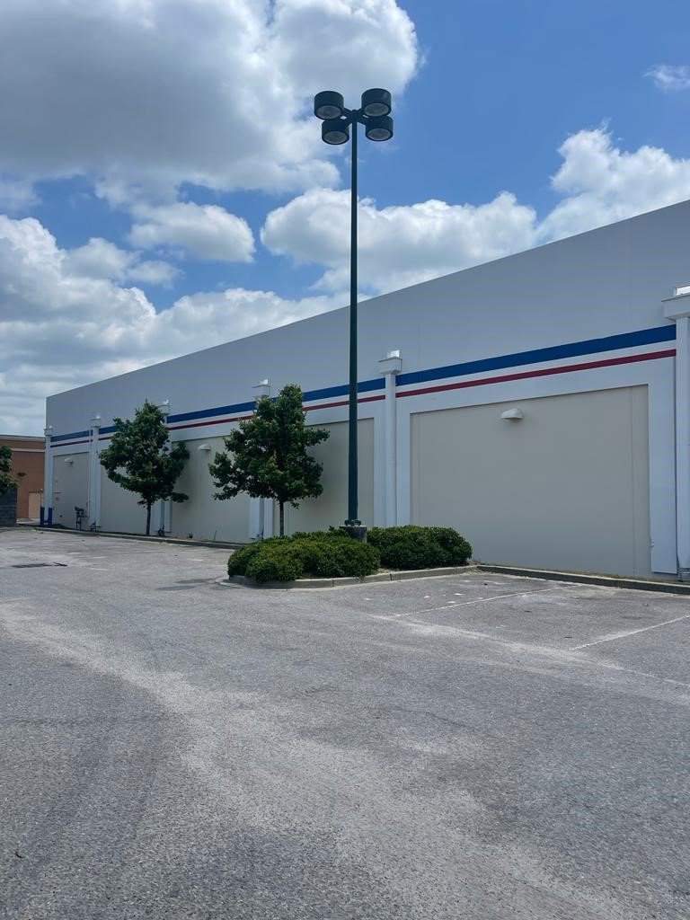 Commercial building exterior repaint project by Painting Professionals, Inc. in Houston, TX