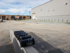 Commercial building with a loading dock area and new pavement, completed by Integrated Building Systems, Inc. in Westmont, IL.