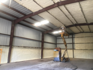 Spray foam insulation applied to the ceiling and walls of a large commercial building project by Spray Foam Solutions Of Erie in Erie, PA.