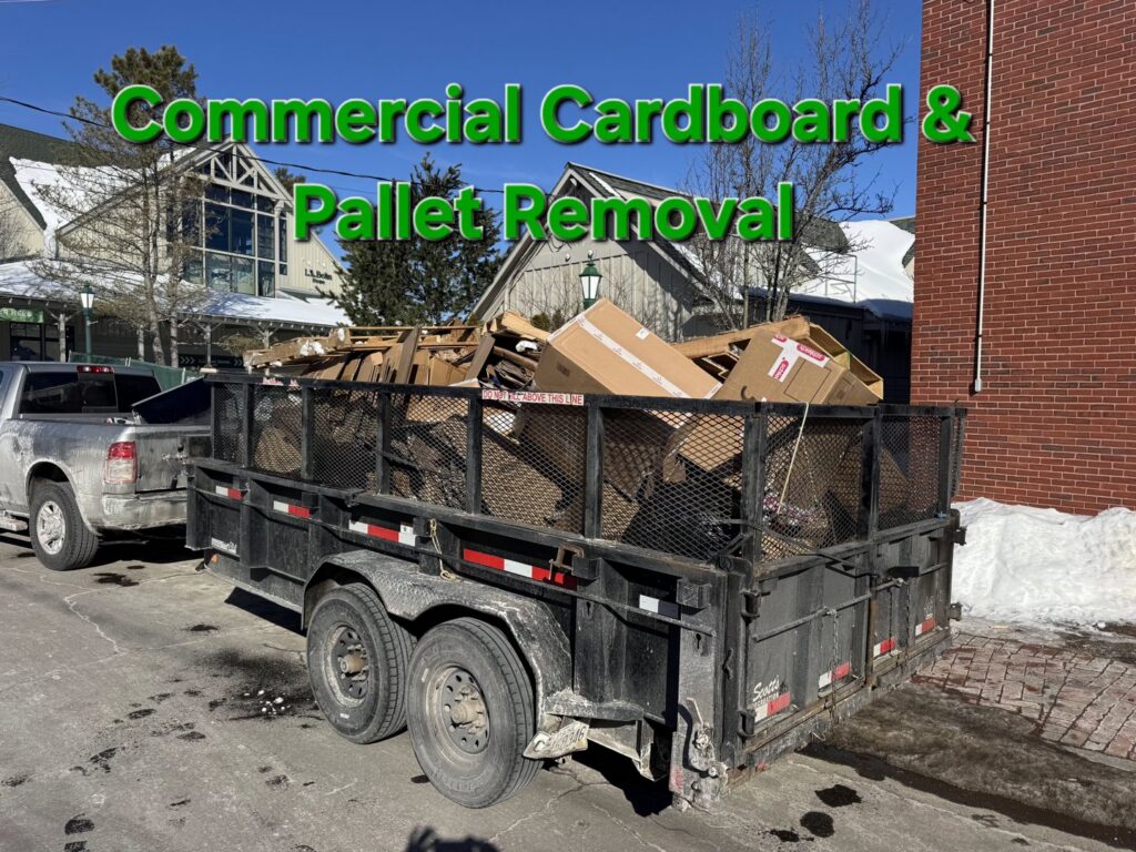 A Rubbish Doctor trailer full of cardboard and pallets for commercial removal in Portland, ME.