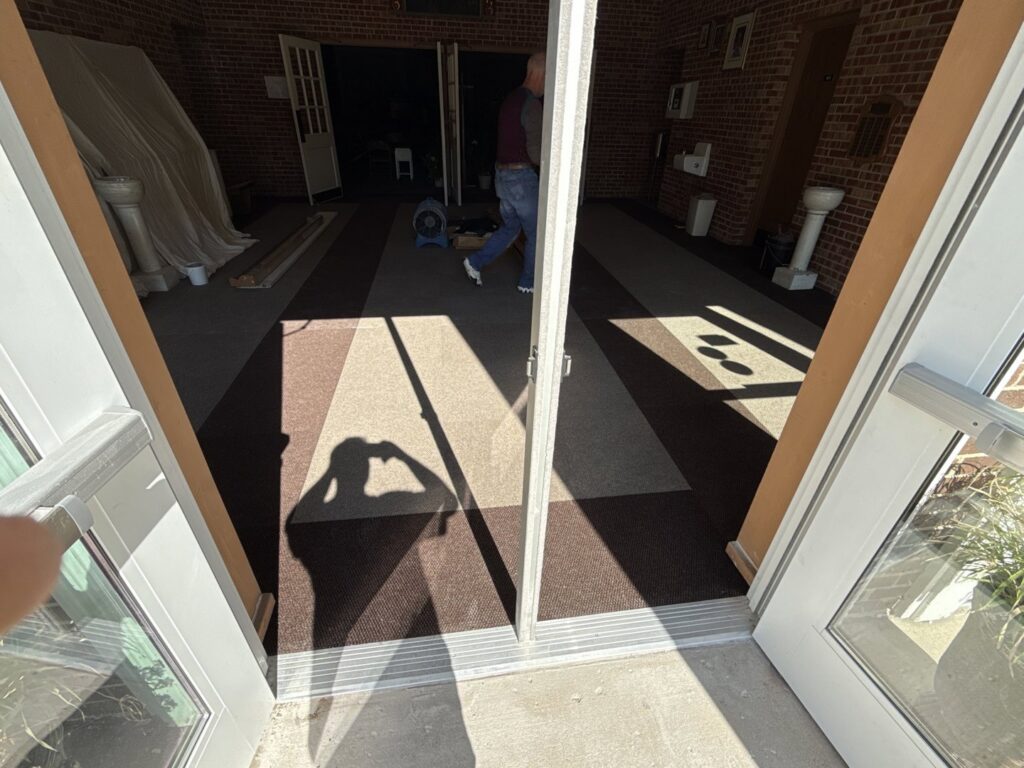 New commercial carpet installed at a building entrance by D E Custom Floors in Waukesha, WI.