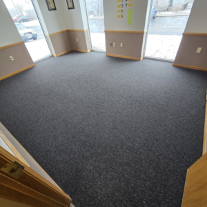 Dark gray commercial carpet installation in an office space by L.A. Floors in Madison, WI.