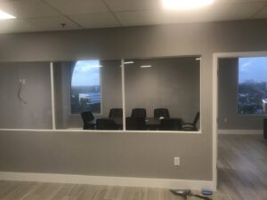 A commercial conference room build-out with large windows by BRM Construction in Miami, FL.