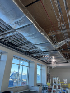 Commercial ductwork insulation being installed by Performance Insulation of Wisconsin LLC in Green Bay, WI.