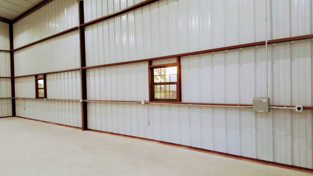 Interior of a commercial building showing exposed electrical conduit and boxes installed by Denali Electric LLC in San Antonio, TX