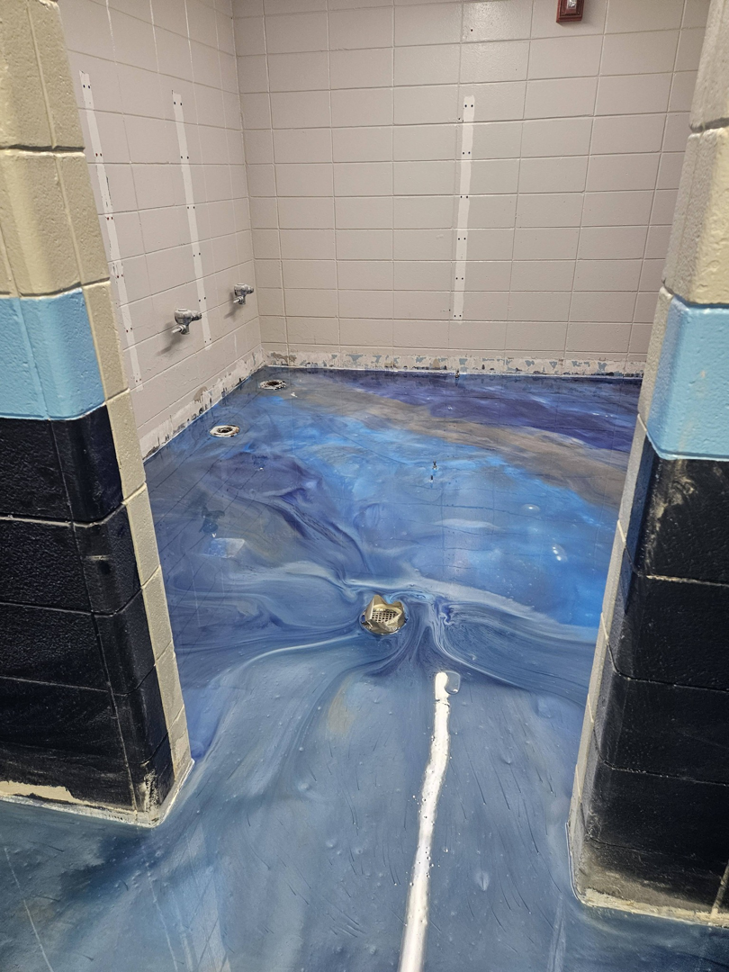 A wide view of a commercial epoxy floor project completed by New Age Decorative Concrete in Broussard, LA.