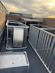 A truck bed filled with commercial equipment for removal by Clean Slate Removal in Grand Island, NE.