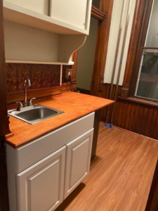 A large commercial room with new flooring and updated lighting installed by Contollo Field Services in Pueblo, CO