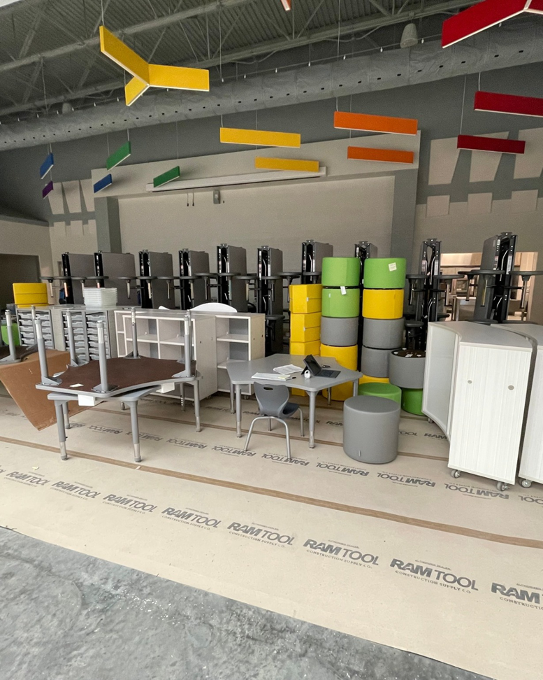 Commercial furniture assembly in progress, showcasing handyman services by Jez Enterprises in Aurora, CO.