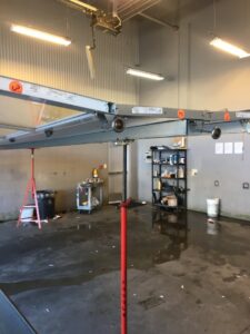 Interior of a commercial garage door service center with tracks and equipment at Overhead Door Company of Columbus in Columbus, GA.