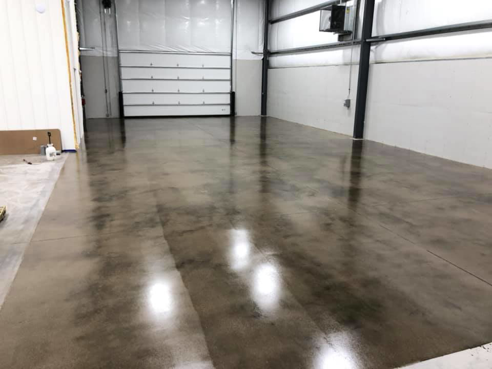 A polished concrete floor in a commercial garage space by Kentucky Decorative Concrete in Nicholasville, KY.