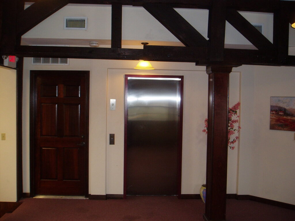 Modern interior hallway with a newly installed elevator, a project by Gourley Contractors, LLC, Corpus Christi, TX.