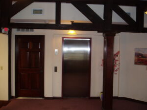 Modern interior hallway with a newly installed elevator, a project by Gourley Contractors, LLC, Corpus Christi, TX.