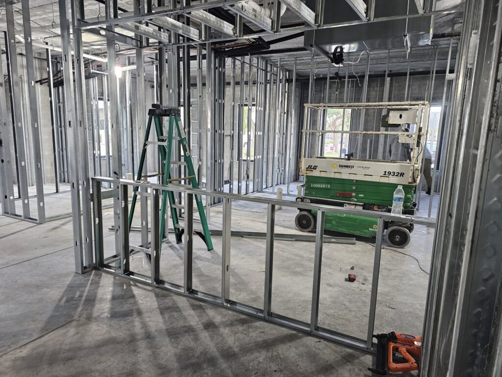 Interior metal stud framing for new commercial construction, showcasing general contractor work by Belair Inc. in Saint Cloud, FL