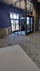 Metal stud framing for new interior walls in a commercial space by NED CO. in Springfield, MA.