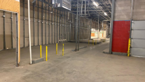 Interior of a commercial space undergoing renovation with metal framing by Crosslands Companies in Englewood, CO