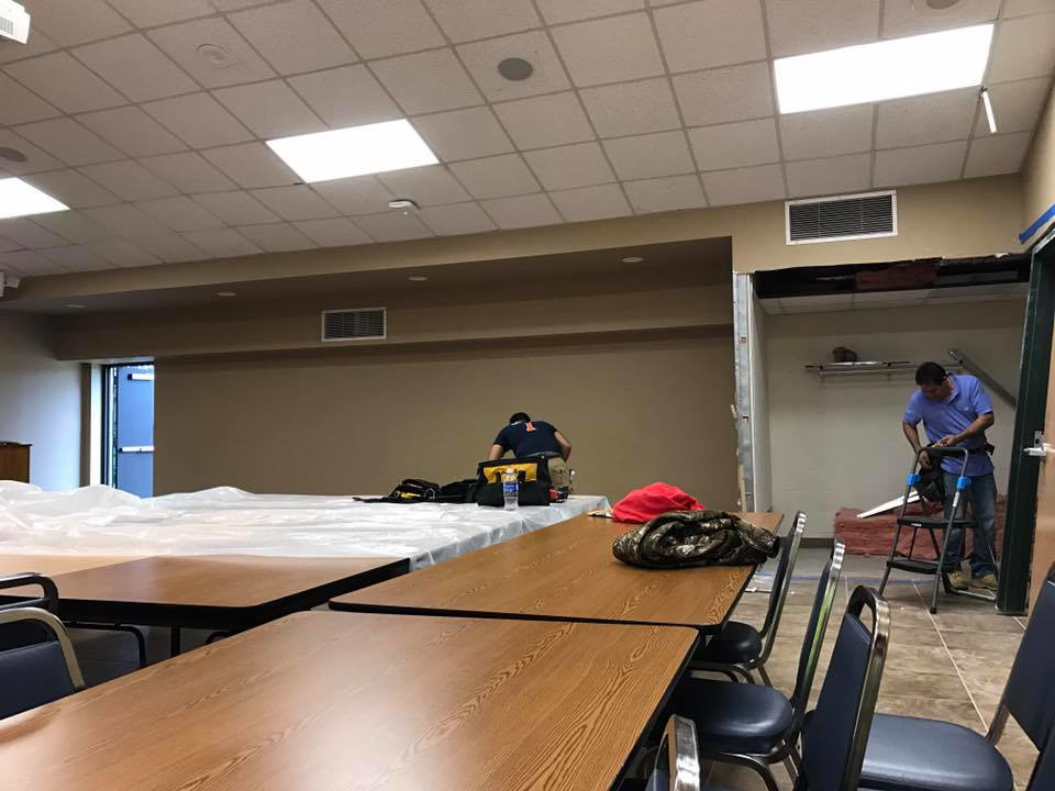 Workers performing an interior commercial renovation project for Whitehorn Construction in Austin, TX.