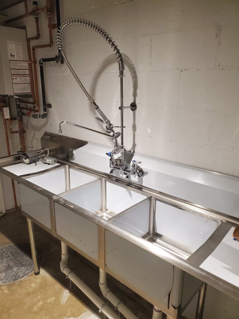 Commercial kitchen faucet and sink installation by Snyder Solutions LLC, providing handyman services in Richmond, VA