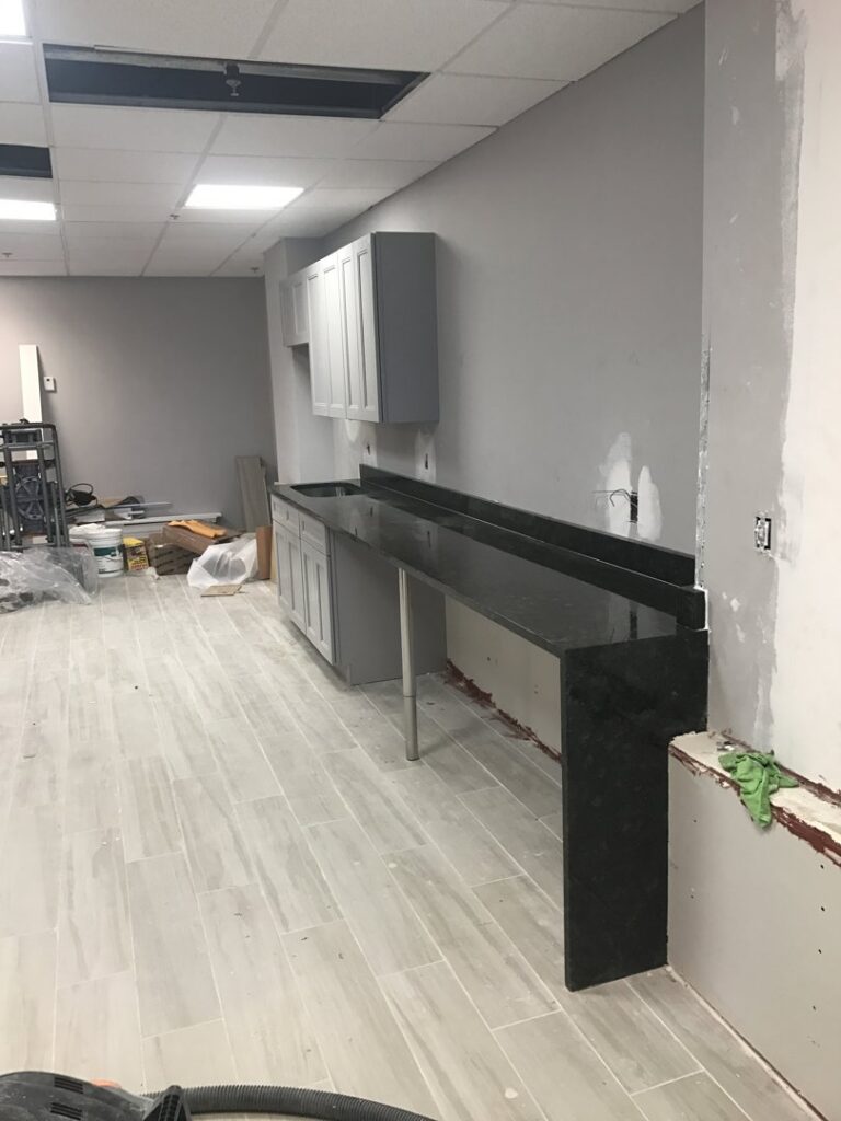 A commercial kitchenette installation in progress with new cabinets and countertops by BRM Construction in Miami, FL.