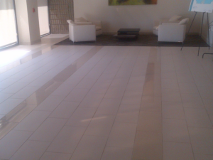 Sleek, modern tile flooring in a commercial lobby installed by Guaranteed Installations in Tampa, FL.