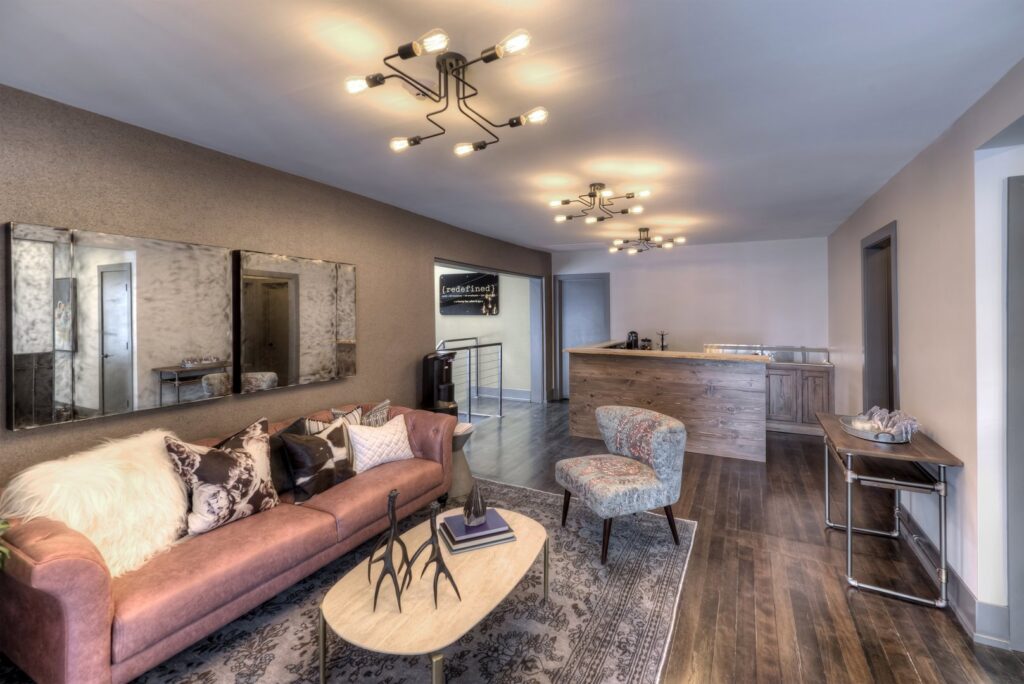 A sophisticated commercial lounge area with modern furniture and unique lighting by Inland Home Remodeling Inc. in Chicago, IL.