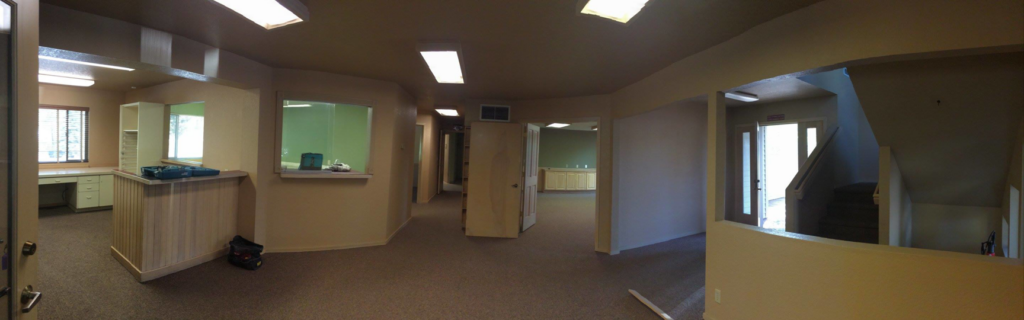Panoramic view of a newly renovated commercial office interior by Winch Construction in Bend, OR.