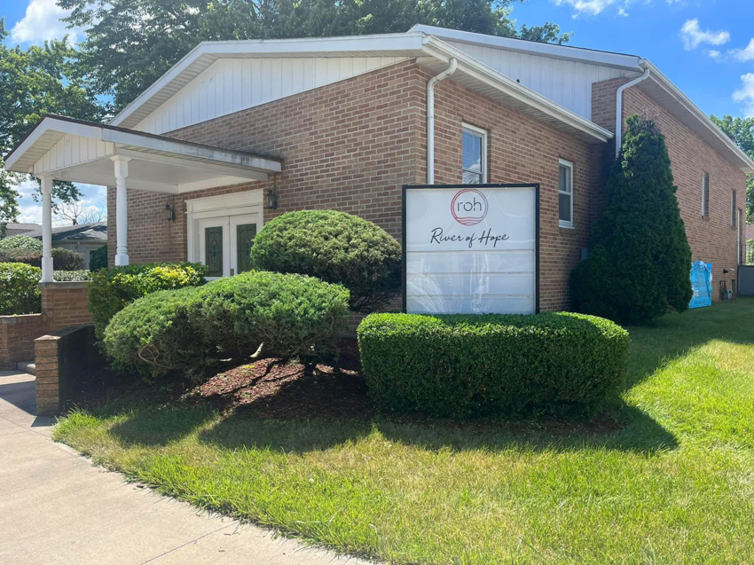 Exterior of a commercial property with well-maintained landscaping by E&K Property Preservation in Lake, MI.
