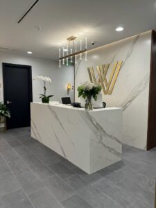 A stylish commercial reception desk area completed by BDM Construction, Inc in Orlando, FL