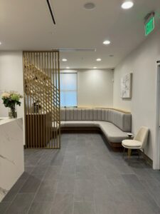 A modern commercial reception and waiting area completed by BDM Construction, Inc in Orlando, FL