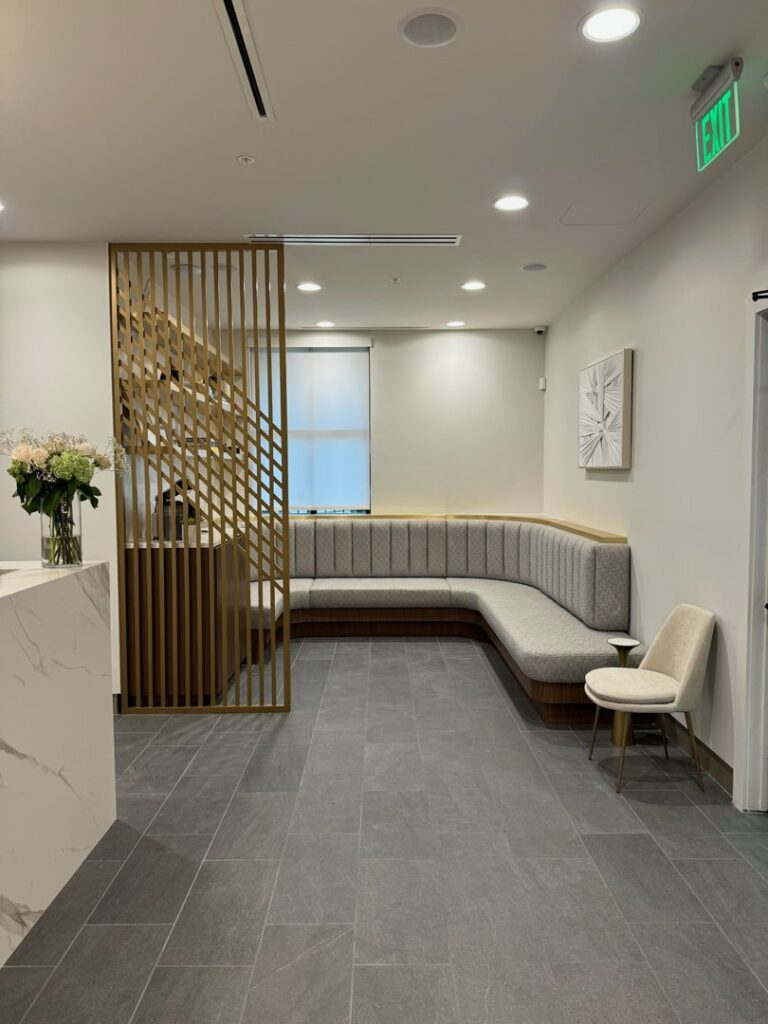 A modern commercial reception and waiting area completed by BDM Construction, Inc in Orlando, FL