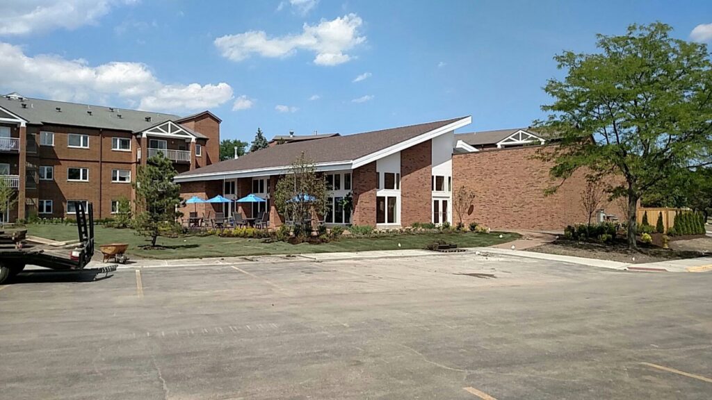 A commercial or residential building with new landscaping and construction work in progress by Frontier Construction, Inc. in Chicago, IL.
