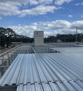 Commercial building roof under construction with metal decking by MEC General Contractors in Melbourne, FL.
