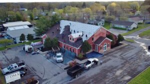 An aerial view of a commercial roofing project in progress by Southern Roofing and Renovations Clarksville in Orlando, FL.