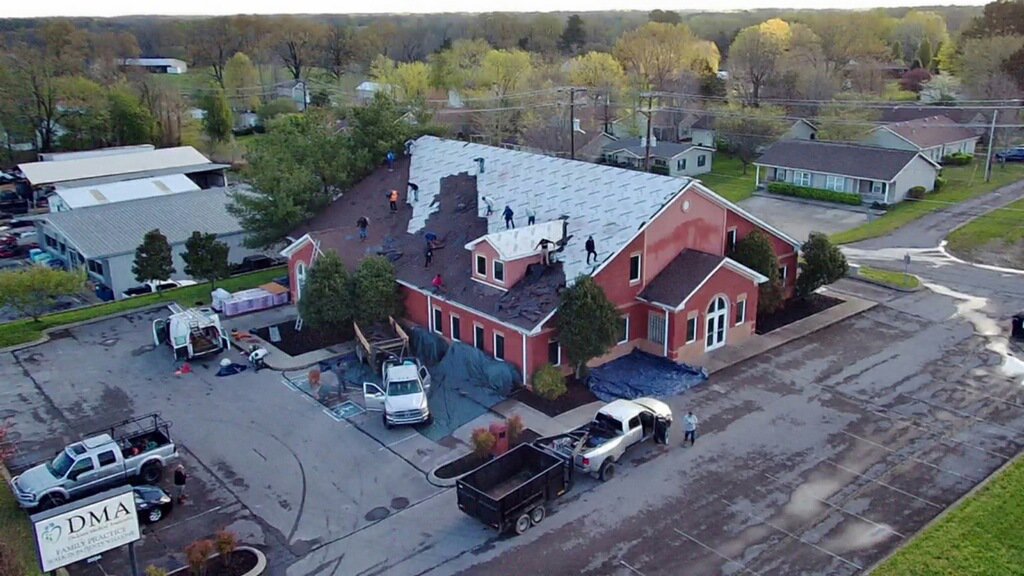 An aerial view of a commercial roofing project in progress by Southern Roofing and Renovations Clarksville in Orlando, FL.