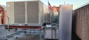 A large commercial rooftop HVAC unit installed on a building, serviced by Pollock HVAC & Electrical in Albany, GA