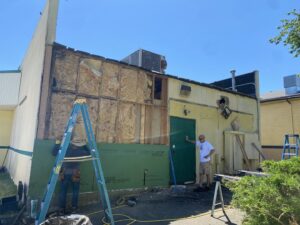 Commercial building exterior undergoing siding replacement and renovation by Amaro home improvement llc in Danbury, CT.