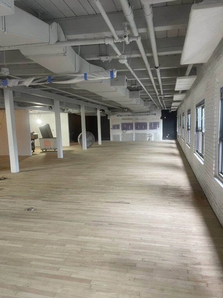 Commercial space under renovation with light hardwood floors by Diamond Flooring LLC in Boston, MA