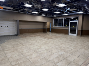 A large commercial space undergoing renovation with new tile flooring by P.G.R Construction,Inc in Rehoboth, MA.