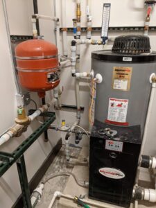 A commercial water heater and expansion tank installation by Top-Notch Plumbing, Heating & Air in Greeley, CO.