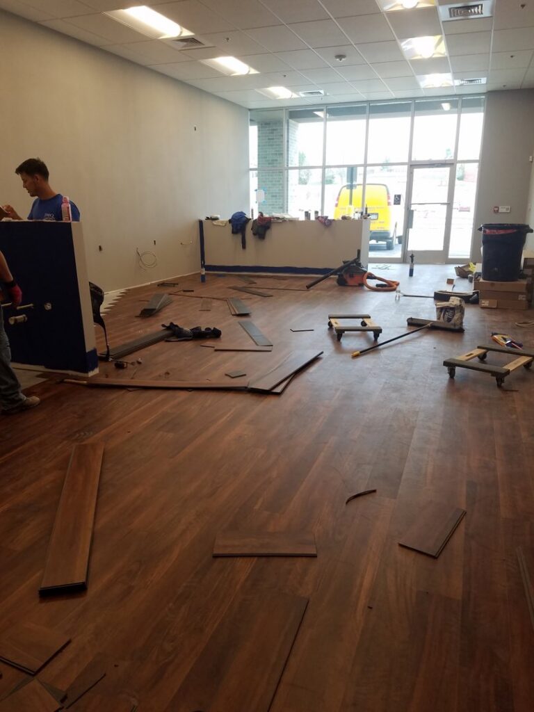 Wood flooring installation in progress in a commercial space by JMQ Contractor INC in Philadelphia, PA