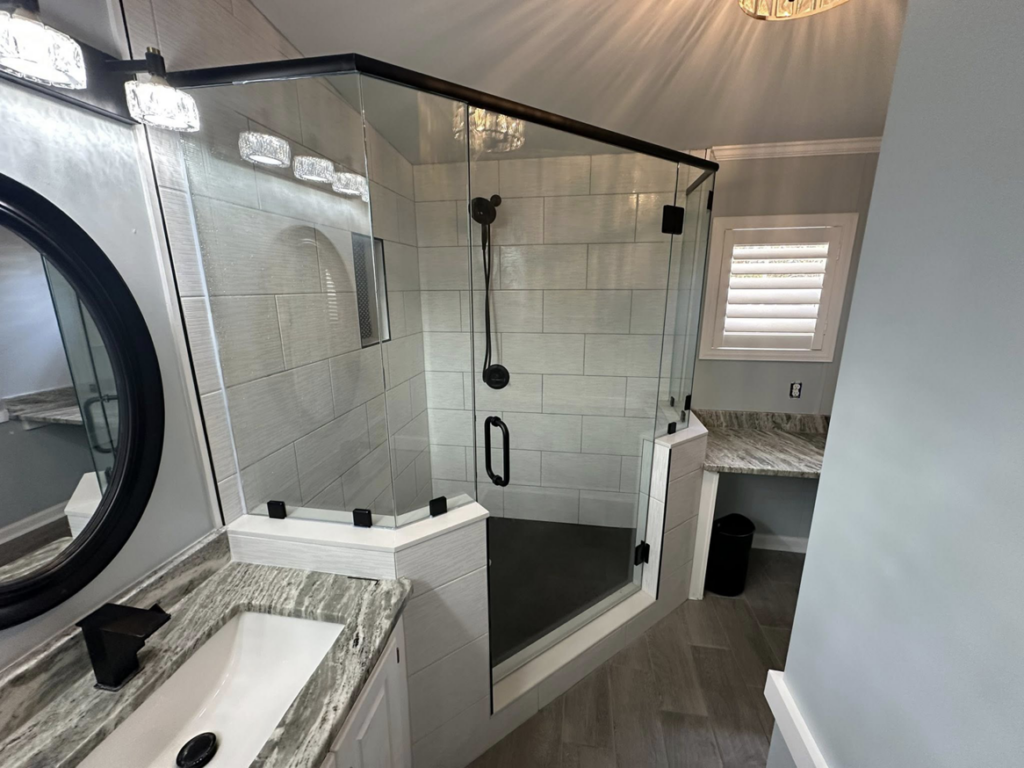 A complete bathroom renovation featuring a new shower and vanity by W. Brian Roberts Construction in Wilmington, NC