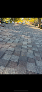 A view of a newly completed asphalt shingle roof, demonstrating quality roofing services from AK Overhead Door & Handyman Services in Wetumpka, AL.
